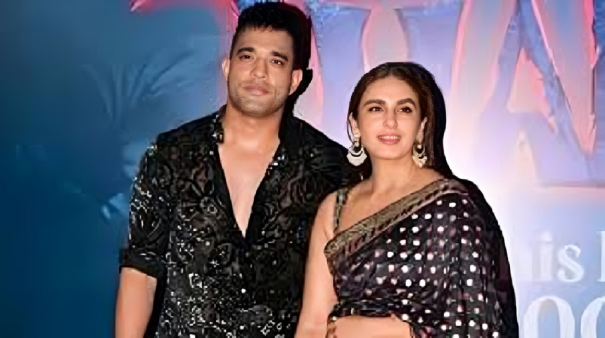Huma Qureshi and Rachit Singh at Bollywood red carpet smiling and posing.