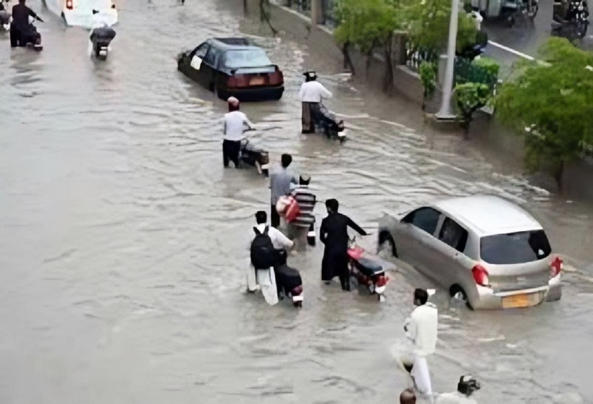 Flooded Karachi street during heavy rainfall and urban flooding alert