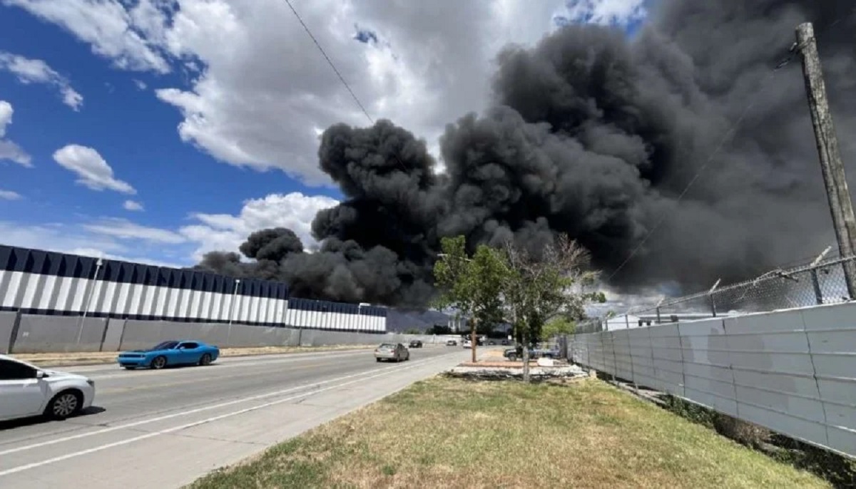Salt Lake City industrial structure fire smoke plume rising from Metech Recycling on Orange Street