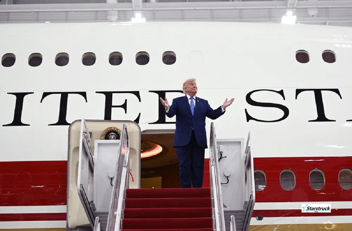President Donald Trump waving from the steps of the Trump new Air Force One, a refurbished $400 million luxury Boeing 747 gifted by Qatar, at Joint Base Andrews.