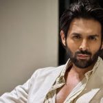 Kartik Aaryan Knee Surgery: Actor Hospitalized After Action Scene Blitz Bollywood actor Kartik Aaryan posing at an official event before his set injury
