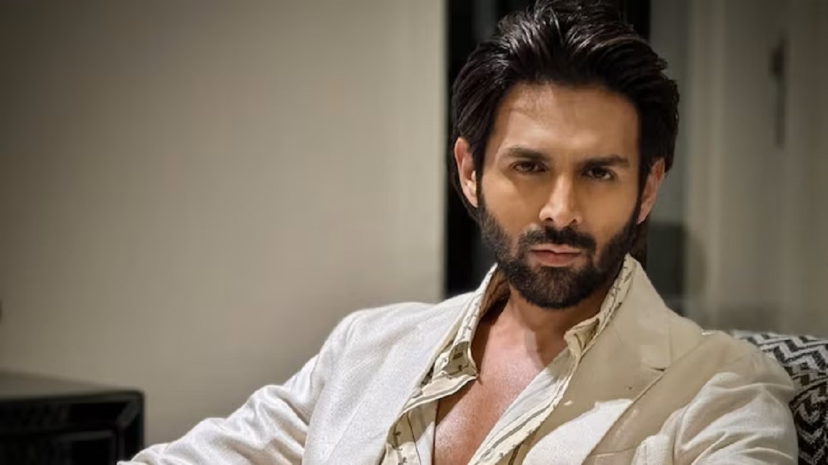Bollywood actor Kartik Aaryan posing at an official event before his set injury