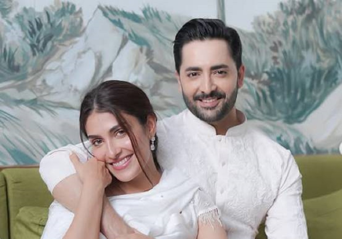 Pakistani actress Ayeza Khan smiling alongside her husband Danish Taimoor at an event after shutting down separation claims