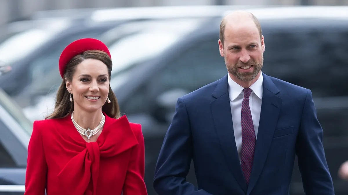 King Charles III and Kate Middleton Princess of Wales standing together at a formal royal event, highlighting the monarchy's branding conflict over her official name spelling.