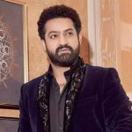 Jr NTR Shoulder Surgery: Health Update & 3-Month Recovery Details Superstar Jr NTR posing at a media event before his shoulder surgery at KIMS Hospital in Hyderabad.
