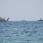 Iran-Oman Strait of Hormuz Deal Near: Why Waterway Won't Fully Open Commercial oil tanker navigating the narrow shipping lanes of the Strait of Hormuz near Oman and Iran.