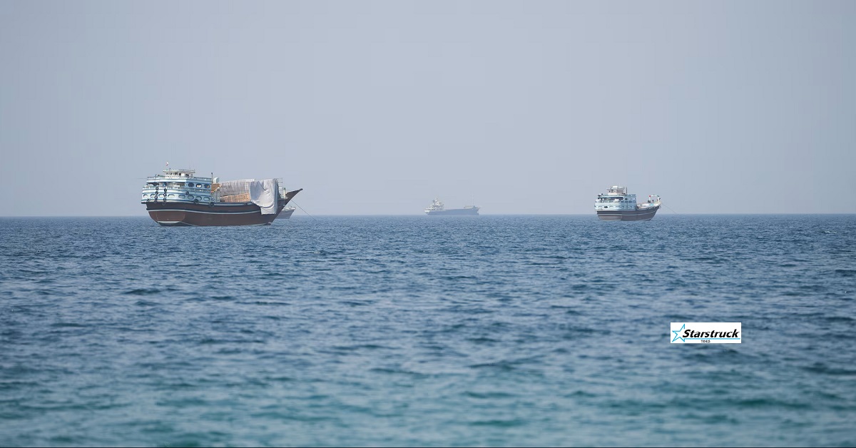 Commercial oil tanker navigating the narrow shipping lanes of the Strait of Hormuz near Oman and Iran.