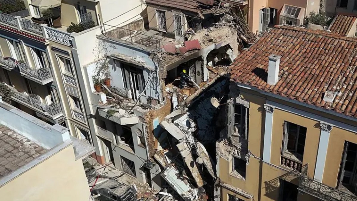 Rescue crews search a collapsed building after an explosion in Athens’ Plaka district near the Acropolis
