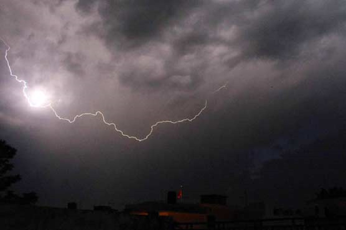 Thunderstorm clouds over a landscape during Pakistan's October weather forecast