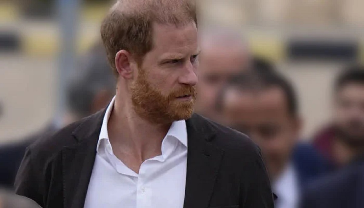 Prince Harry and King Charles III in a royal family photograph